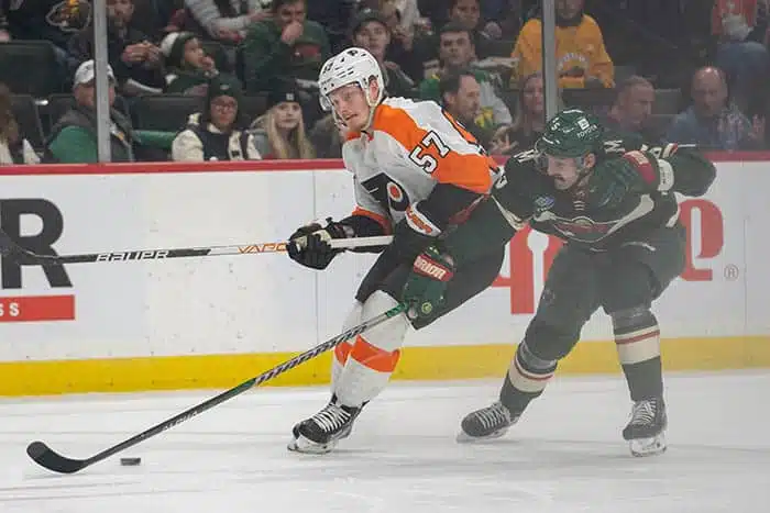 Philadelphia Flyers right wing Wade Allison (57) and Minnesota Wild defenseman Jake Middleton (5) at Xcel Energy Center.