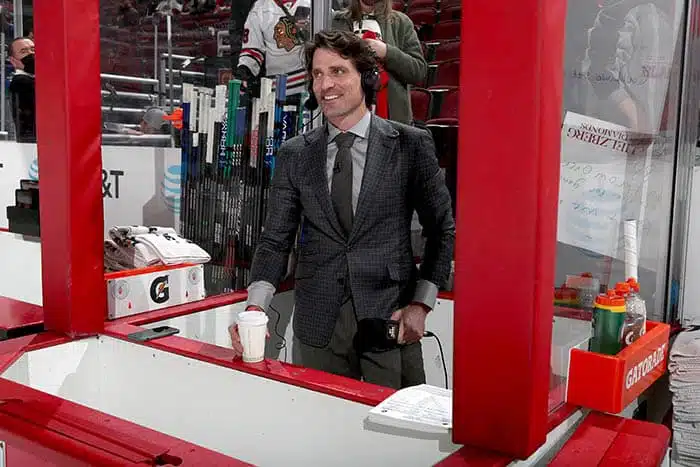 NBC Sports analyst and former NHL player, Patrick Sharp, stands in between the benches prior to the game between the Chicago Blackhawks and the Vancouver Canucks at United Center on January 31, 2022 in Chicago, Illinois.