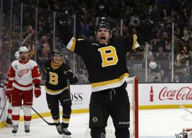 Boston Bruins right wing Garnet Hathaway (21) celebrates his go ahead goal as Detroit Red Wings center Dylan Larkin (71) (left) looks on during the third period at TD Garden.