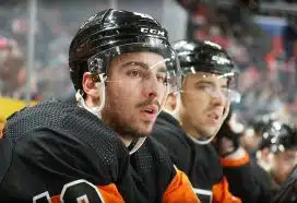 Noah Cates #49 of the Philadelphia Flyers watches the play on the ice during the first period against the Vancouver Canucks at the Wells Fargo Center on October 15, 2022 in Philadelphia, Pennsylvania.