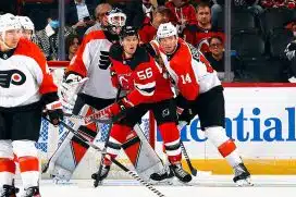 Sean Couturier #14 of Philadelphia Flyers skates against Erik Haula #56 of New Jersey Devils of the New Jersey Devils at a preseason game at the Prudential Center on September 25, 2023 in Newark, New Jersey.