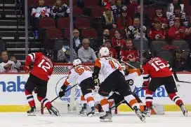 New Jersey Devils right wing Tyce Thompson (12) scores a goal on Philadelphia Flyers goaltender Cal Petersen (40) during the first period at Prudential Center.