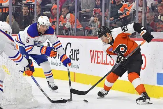 Philadelphia Flyers right wing Cam Atkinson (89) battle for the puck with Edmonton Oilers defenseman Cody Ceci (5) during the third period at Wells Fargo Center.