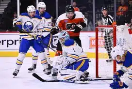 Philadelphia Flyers right wing Garnet Hathaway (19) watches the puck over Buffalo Sabres goalie Ukko-Pekka Luukkonen (1) in the first period at Wells Fargo Center.