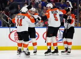 Nov 3, 2023; Buffalo, New York, USA; Philadelphia Flyers defensemen Louie Belpedio (37) celebrates his goal with teammates during the first period against the Buffalo Sabres at KeyBank Center.