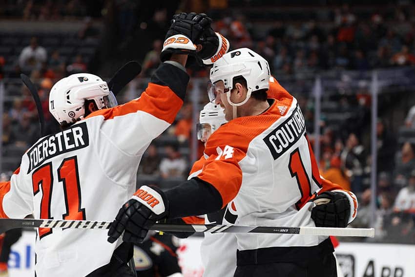 Philadelphia Flyers center Sean Couturier (14) celebrates with right wing Tyson Foerster (71) after scoring a goal during the first period against the Anaheim Ducks at Honda Center.