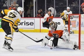 Philadelphia Flyers goaltender Carter Hart (79) makes a save against Pittsburgh Penguins center Jeff Carter (77) during the second period at Wells Fargo Center.