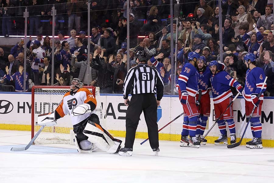 New York Rangers center Vincent Trocheck (16) celebrates his goal against Philadelphia Flyers goaltender Samuel Ersson (33) with defenseman K'Andre Miller (79) and center Mika Zibanejad (93) and defenseman Braden Schneider (4) during the third period at Madison Square Garden.