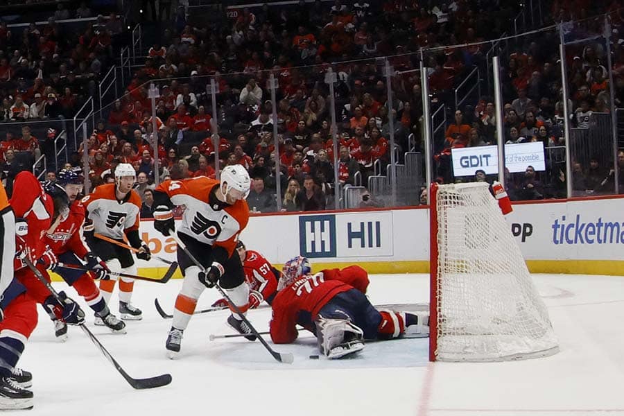 Washington Capitals goaltender Charlie Lindgren (79) makes a save on Philadelphia Flyers center Sean Couturier (14) in the third period at Capital One Arena.