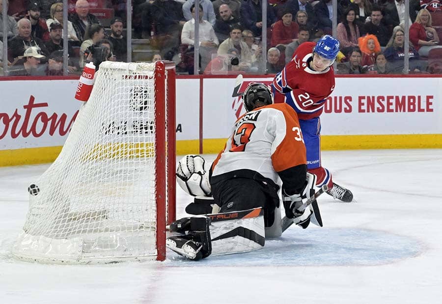 Montreal Canadiens forward Juraj Slafkovsky (20) scores a goal against Philadelphia Flyers goalie Samuel Ersson (33) during the second period at the Bell Centre.