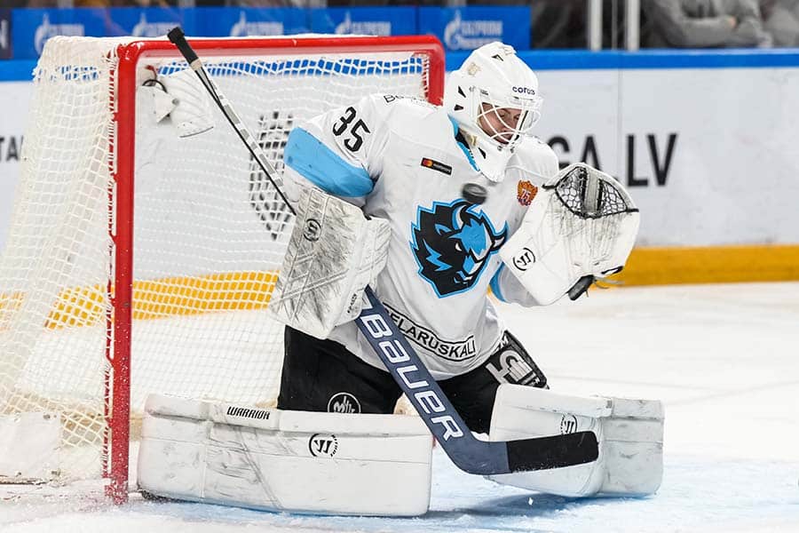 Dinamo Minsk's goalkeeper Alexei Kolosov tries to make a save during the 2021-2022 Kontinental Hockey League KHL ice hockey match between Dinamo Riga and Dinamo Minsk in Riga, Latvia, Dec. 20, 2021.