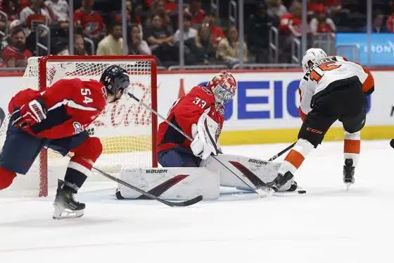 Sep 22, 2024; Washington, District of Columbia, USA; Washington Capitals goaltender Clay Stevenson (33) makes a save on Philadelphia Flyers forward Olle Lycksell (15) in the second period at Capital One Arena.