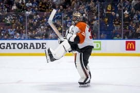 Oct 11, 2024; Vancouver, British Columbia, CAN; Philadelphia Flyers goalie Samuel Ersson (33) celebrates the victory against the Vancouver Canucks at Rogers Arena.