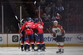 Oct 23, 2024; Washington, District of Columbia, USA; Washington Capitals center Nic Dowd (26) celebrates with teammates after scoring a goal against the Philadelphia Flyers in the second period at Capital One Arena.