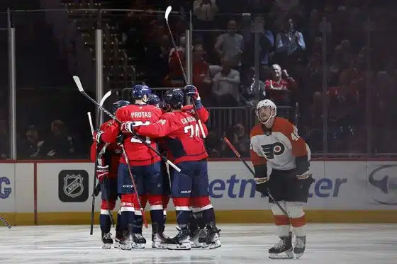 Oct 23, 2024; Washington, District of Columbia, USA; Washington Capitals center Nic Dowd (26) celebrates with teammates after scoring a goal against the Philadelphia Flyers in the second period at Capital One Arena.