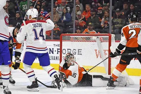 Oct 27, 2024; Philadelphia, Pennsylvania, USA; Montreal Canadiens center Nick Suzuki (14) celebrates his goal against Philadelphia Flyers goaltender Aleksei Kosolov (35) during the first period at Wells Fargo Center.