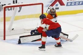 SUNRISE, FLORIDA - NOVEMBER 9: Evan Rodrigues #17 of the Florida Panthers scores in a shootout for the win against Goaltender Samuel Ersson #33 of the Philadelphia Flyers at the Amerant Bank Arena on November 9, 2024 in Sunrise, Florida.