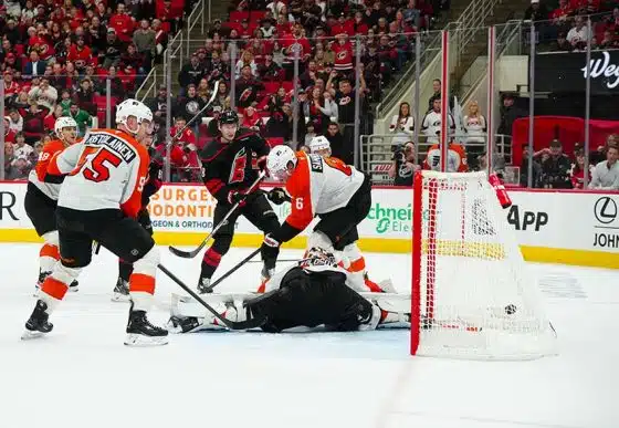 Nov 5, 2024; Raleigh, North Carolina, USA; Carolina Hurricanes center Martin Necas (88) scores the game winner against Philadelphia Flyers goaltender Aleksei Kolosov (35) defenseman Travis Sanheim (6) and defenseman Rasmus Ristolainen (55) during the third period at Lenovo Center.