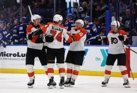 Nov 7, 2024; Tampa, Florida, USA; Philadelphia Flyers right wing Owen Tippett (74) is congratulated by defenseman Travis Sanheim (6) and right wing Bobby Brink (10) after scoring during the overtime shootout against the Tampa Bay Lightning at Amalie Arena.