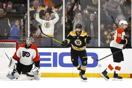 Dec 7, 2024; Boston, Massachusetts, USA; Boston Bruins center Pavel Zacha (18) celebrates after scoring the game winning goal in overtime on Philadelphia Flyers goaltender Aleksei Kolosov (35) as defenseman Rasmus Ristolainen (55) skates away at TD Garden.