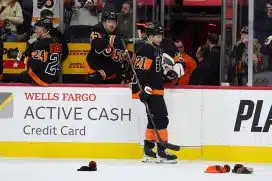 Dec 12, 2024; Philadelphia, Pennsylvania, USA; Philadelphia Flyers defenseman Rasmus Ristolainen (55) sprays center Scott Laughton (21) after he scored a hat-trick goal against the Detroit Red Wings in the third period at Wells Fargo Center.