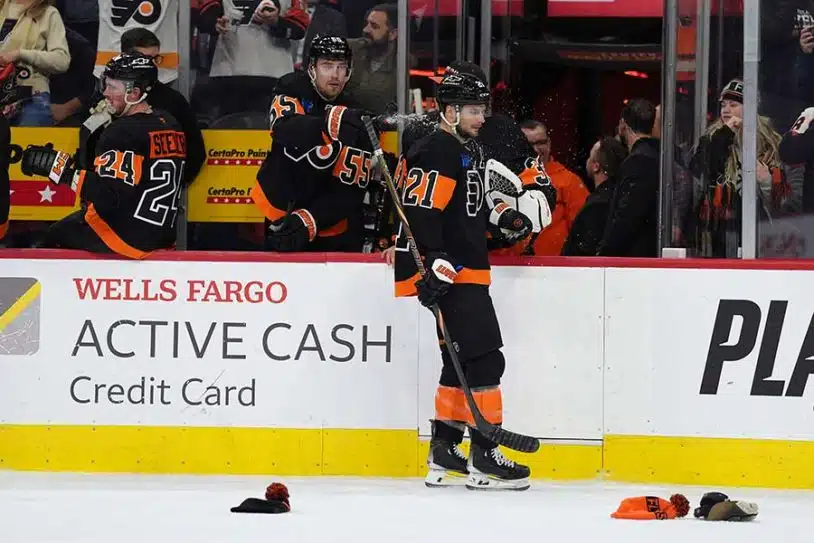 Dec 12, 2024; Philadelphia, Pennsylvania, USA; Philadelphia Flyers defenseman Rasmus Ristolainen (55) sprays center Scott Laughton (21) after he scored a hat-trick goal against the Detroit Red Wings in the third period at Wells Fargo Center.