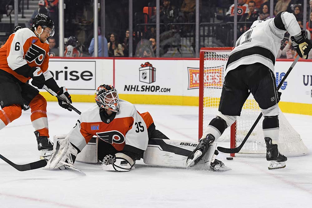 Dec 19, 2024; Philadelphia, Pennsylvania, USA; Los Angeles Kings center Anze Kopitar (11) scores a goal past Philadelphia Flyers goaltender Aleksei Kolosov (35) and defenseman Travis Sanheim (6) during the second period at Wells Fargo Center.